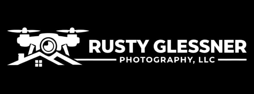 Drone with camera hovering above a rooftop graphic above the text Rusty Glessner Photography, LLC logo representing aerial photography services.